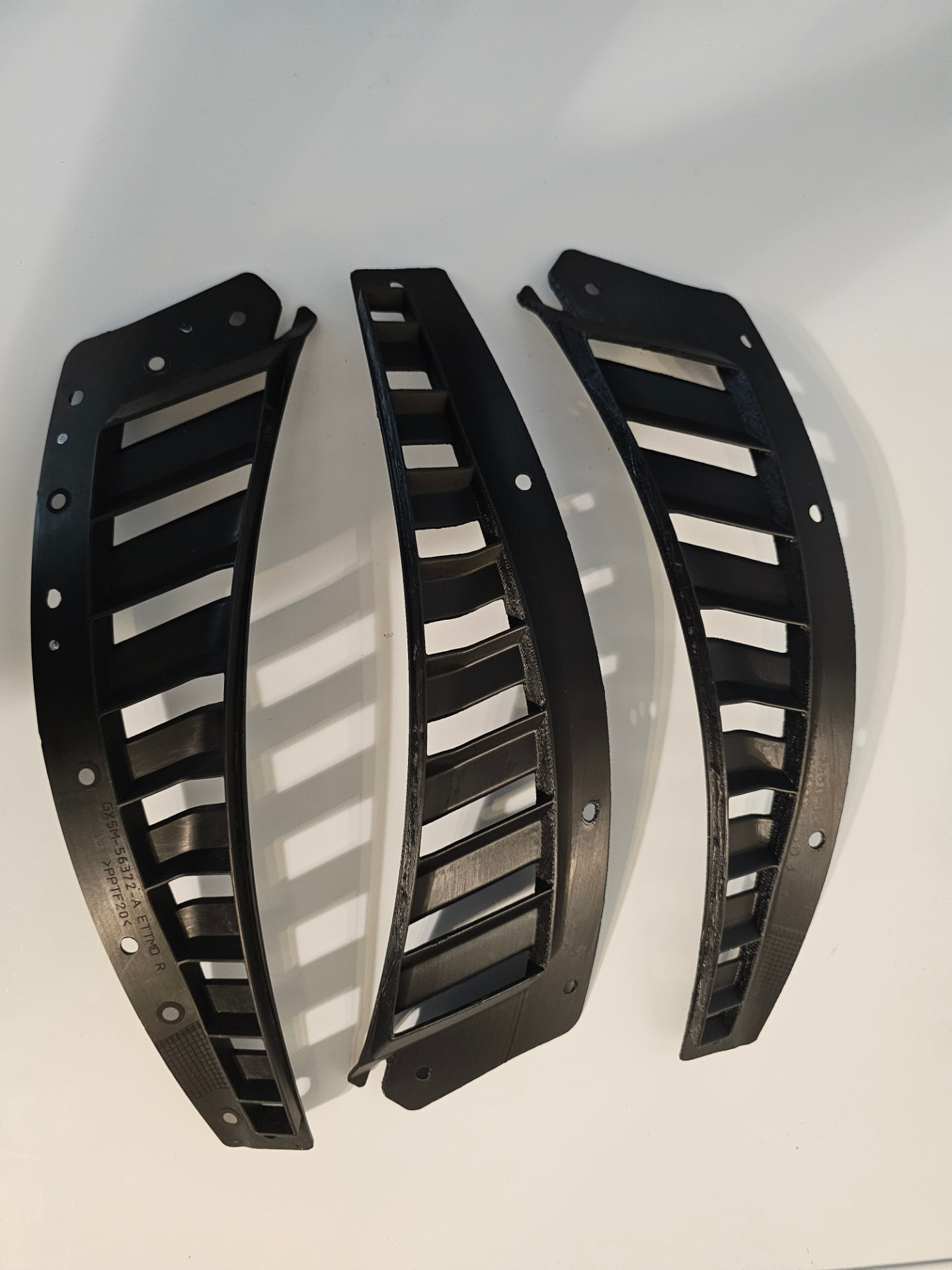 Three Jaguar F-Type SVR hood vent grille reproductions arranged side by side
