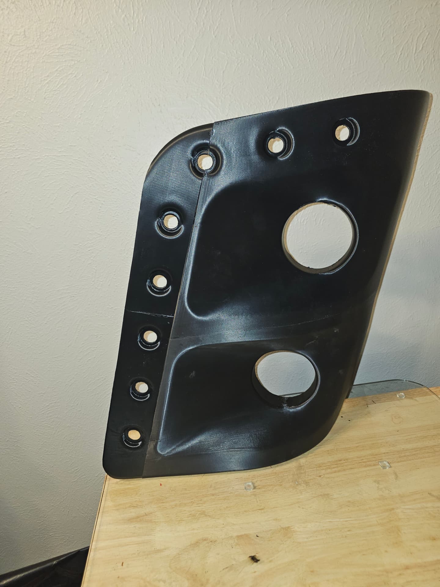 Front view of the matte black 3D-printed 2017 Sportscoach 408DB dual headlight bezel with marker light holes