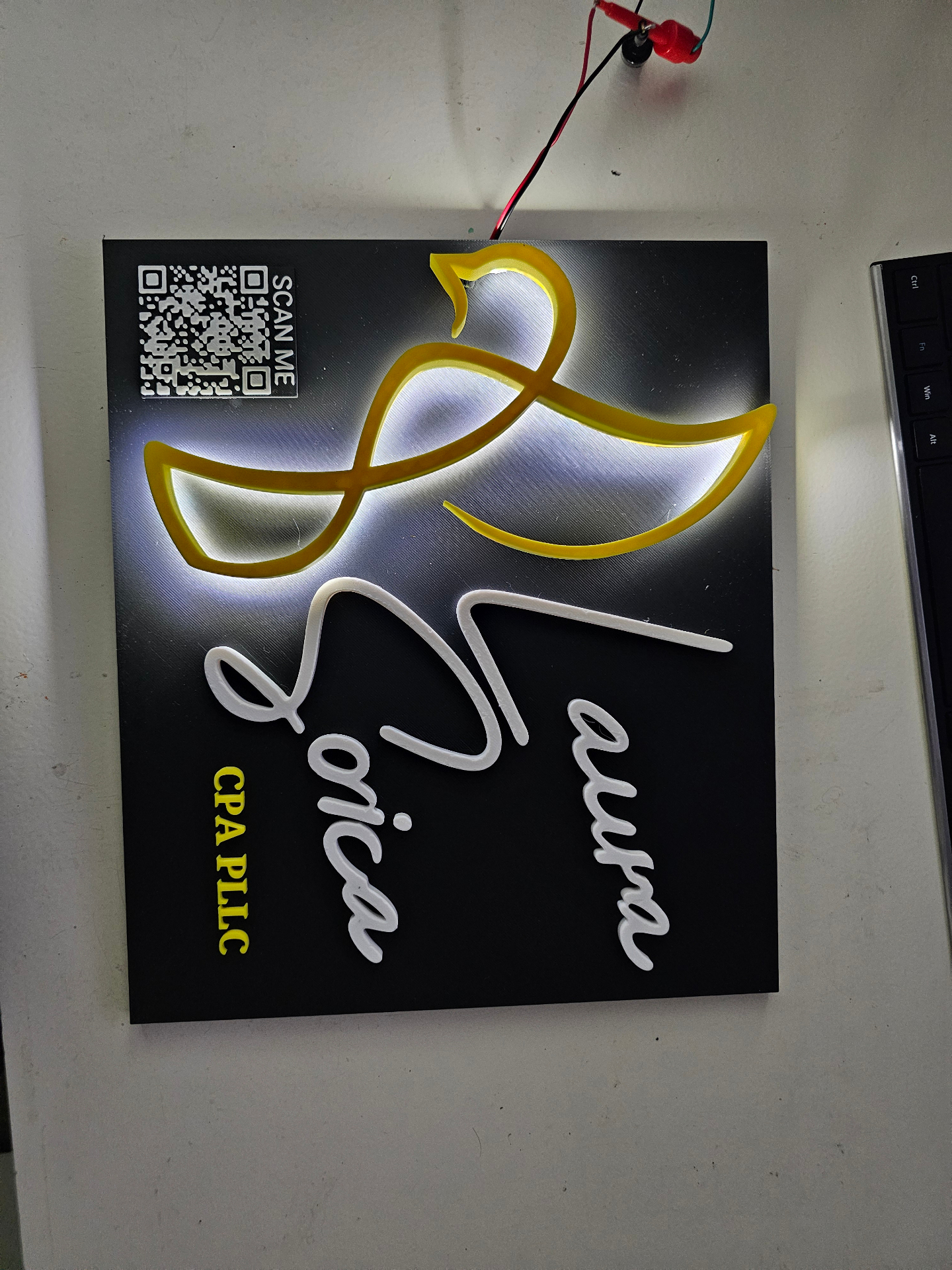Custom 3D-printed backlit company logo sign with integrated QR code
