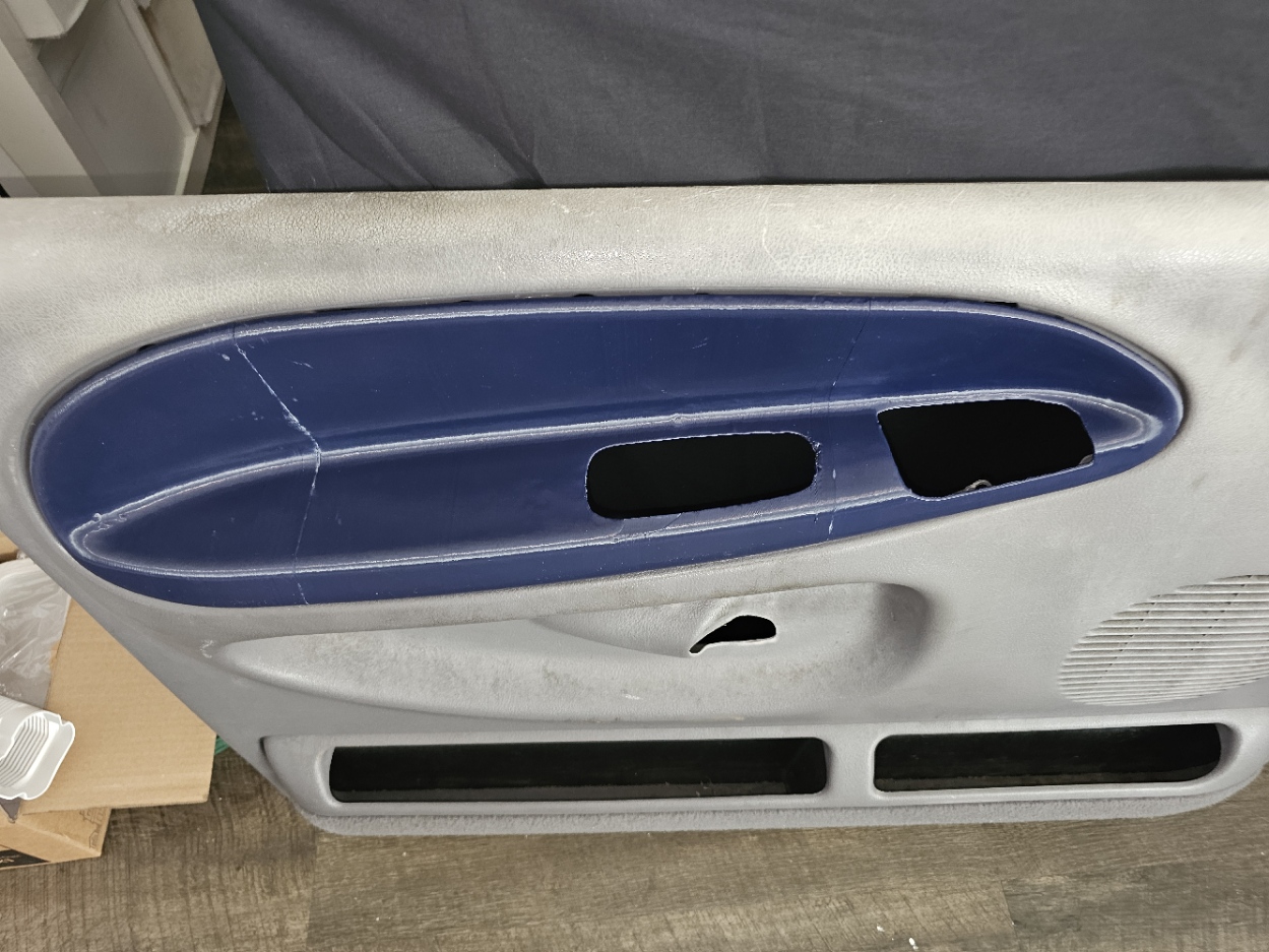 Reproduced armrest installed on the 1999 Dodge Ram door panel