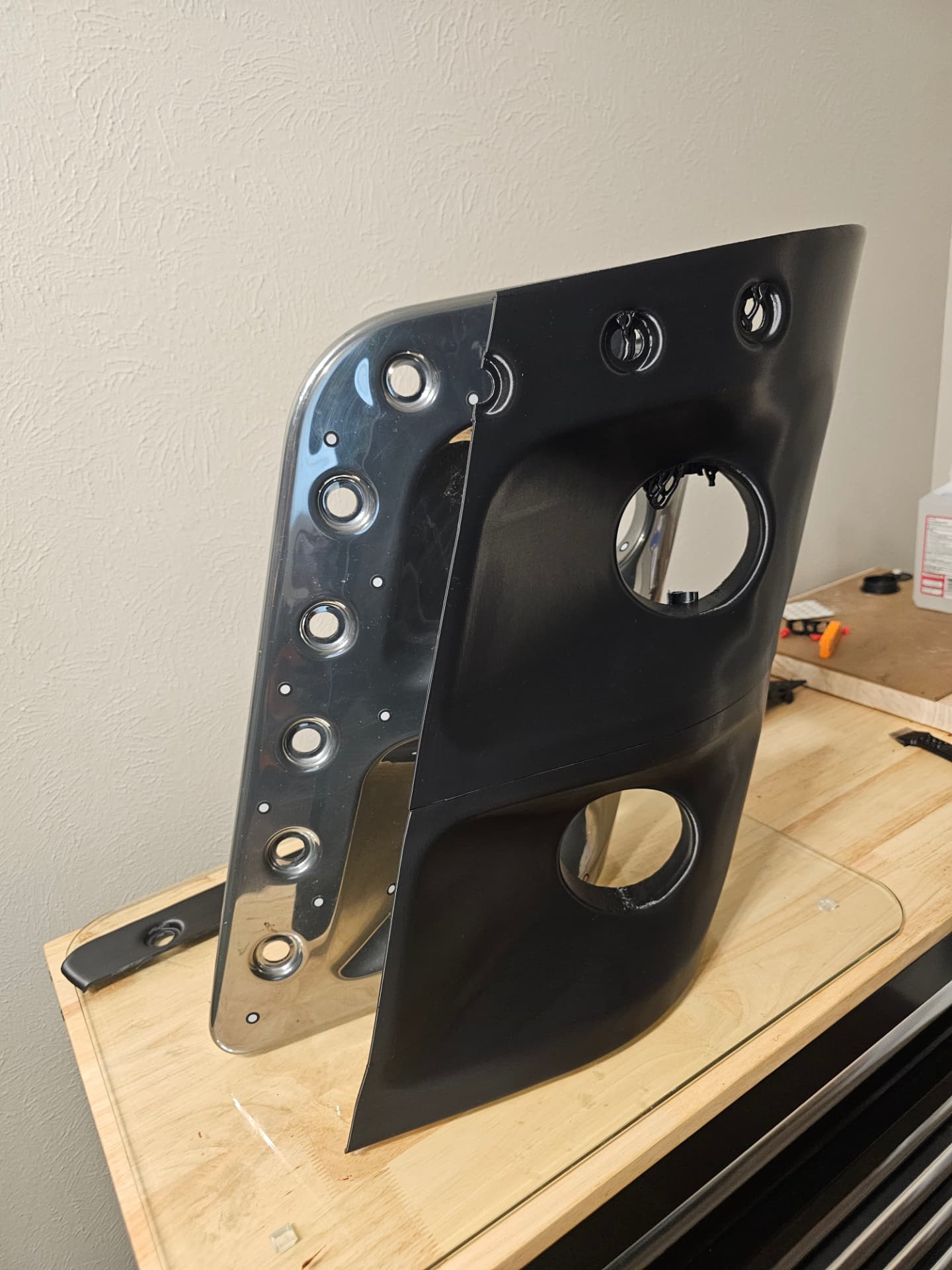 3D-printed 2017 Sportscoach 408DB headlight bezel lined up against the original chrome bezel to confirm the match